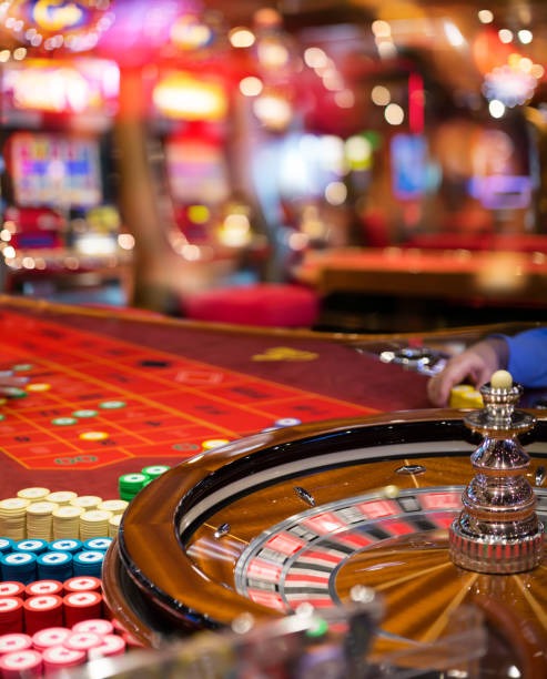 Live dealer at roulette table with multiple camera angles